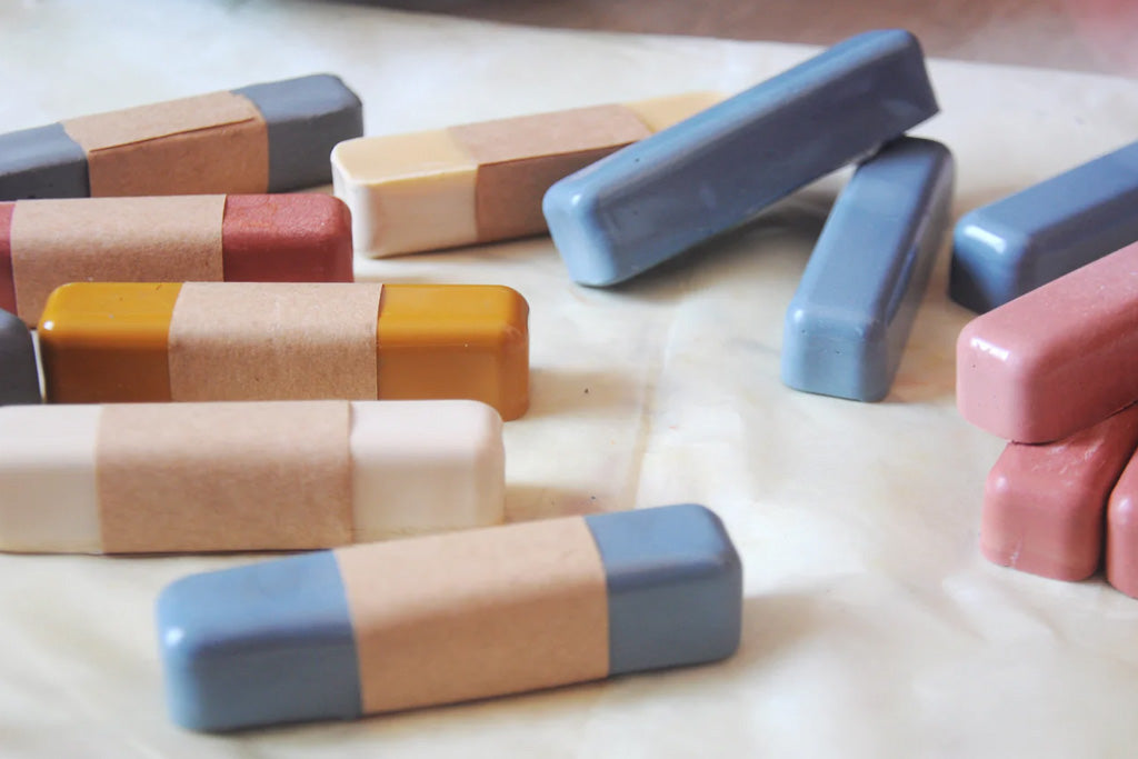 eco-friendly, non-toxic beeswax oil pastels in soft pastel colors for children's creative play.