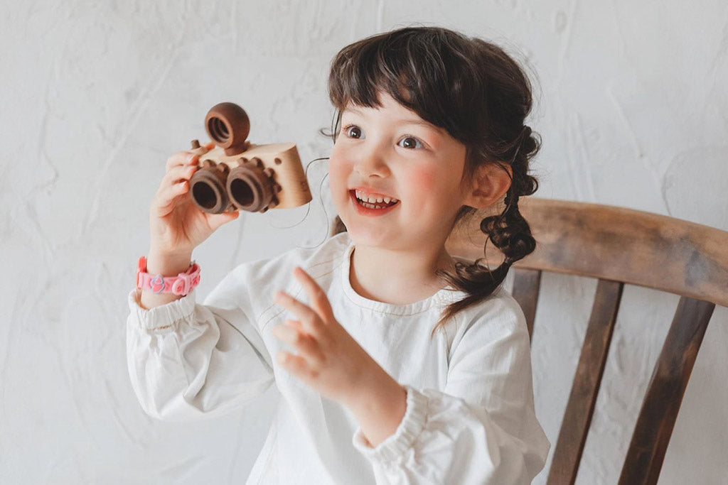 Twinkle wooden toy camera inspired by the stereo camera offers double the fun with two kaleidoscope lenses. Like a wooden binocular toy, Father’s Factory twinkle wooden toy camera has 2 lenses. Children can look through the lenses and find wonders. The kaleidoscopic lens will enhance creativity in children and offers high-quality playtime. Father's factory wooden toys can double as interior decor, kid’s room decor, and playroom display.