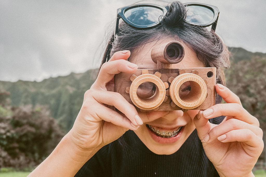 Twinkle wooden toy camera inspired by the stereo camera offers double the fun with two kaleidoscope lenses. Like a wooden binocular toy, Father’s Factory twinkle wooden toy camera has 2 lenses. Children can look through the lenses and find wonders. The kaleidoscopic lens will enhance creativity in children and offers high-quality playtime. Father's factory wooden toys can double as interior decor, kid’s room decor, and playroom display.