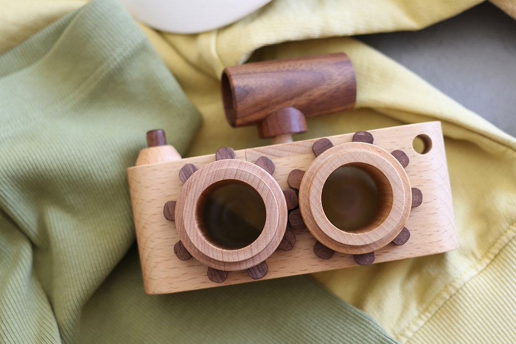 Twinkle wooden toy camera inspired by the stereo camera offers double the fun with two kaleidoscope lenses. Like a wooden binocular toy, Father’s Factory twinkle wooden toy camera has 2 lenses. Children can look through the lenses and find wonders. The kaleidoscopic lens will enhance creativity in children and offers high-quality playtime. Father's factory wooden toys can double as interior decor, kid’s room decor, and playroom display.