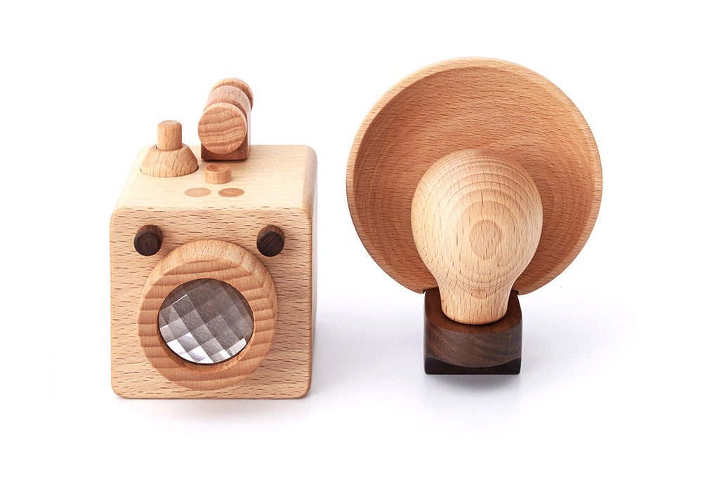 A wooden toy camera inspired by the vintage Kodak Brownie camera, crafted from high-quality walnut and beechwood. This modern take on the classic design is non-toxic, biodegradable, and perfect for children’s open-ended playtime, while also doubling as decor.