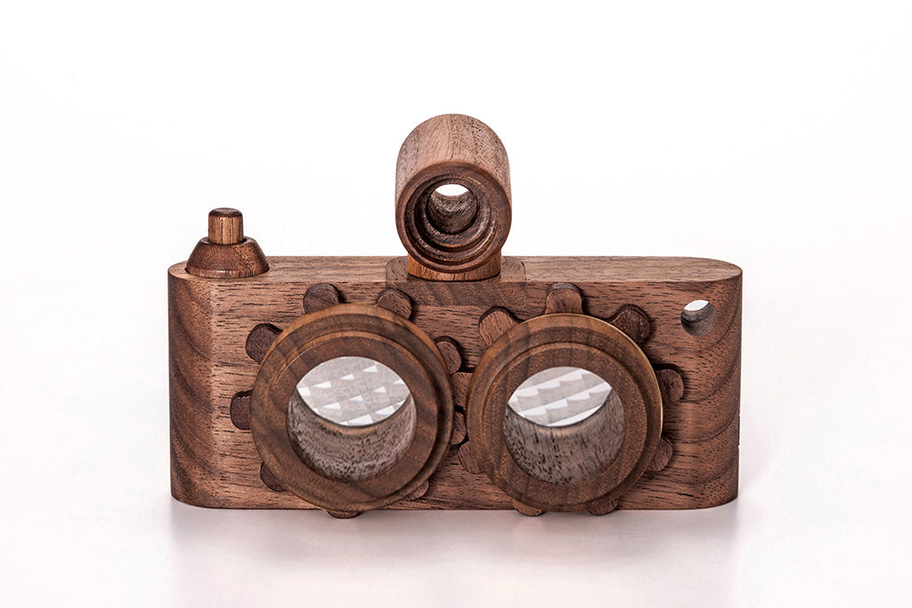 Twinkle wooden toy camera inspired by the stereo camera offers double the fun with two kaleidoscope lenses. Like a wooden binocular toy, Father’s Factory twinkle wooden toy camera has 2 lenses. Children can look through the lenses and find wonders. The kaleidoscopic lens will enhance creativity in children and offers high-quality playtime. Father's factory wooden toys can double as interior decor, kid’s room decor, and playroom display.