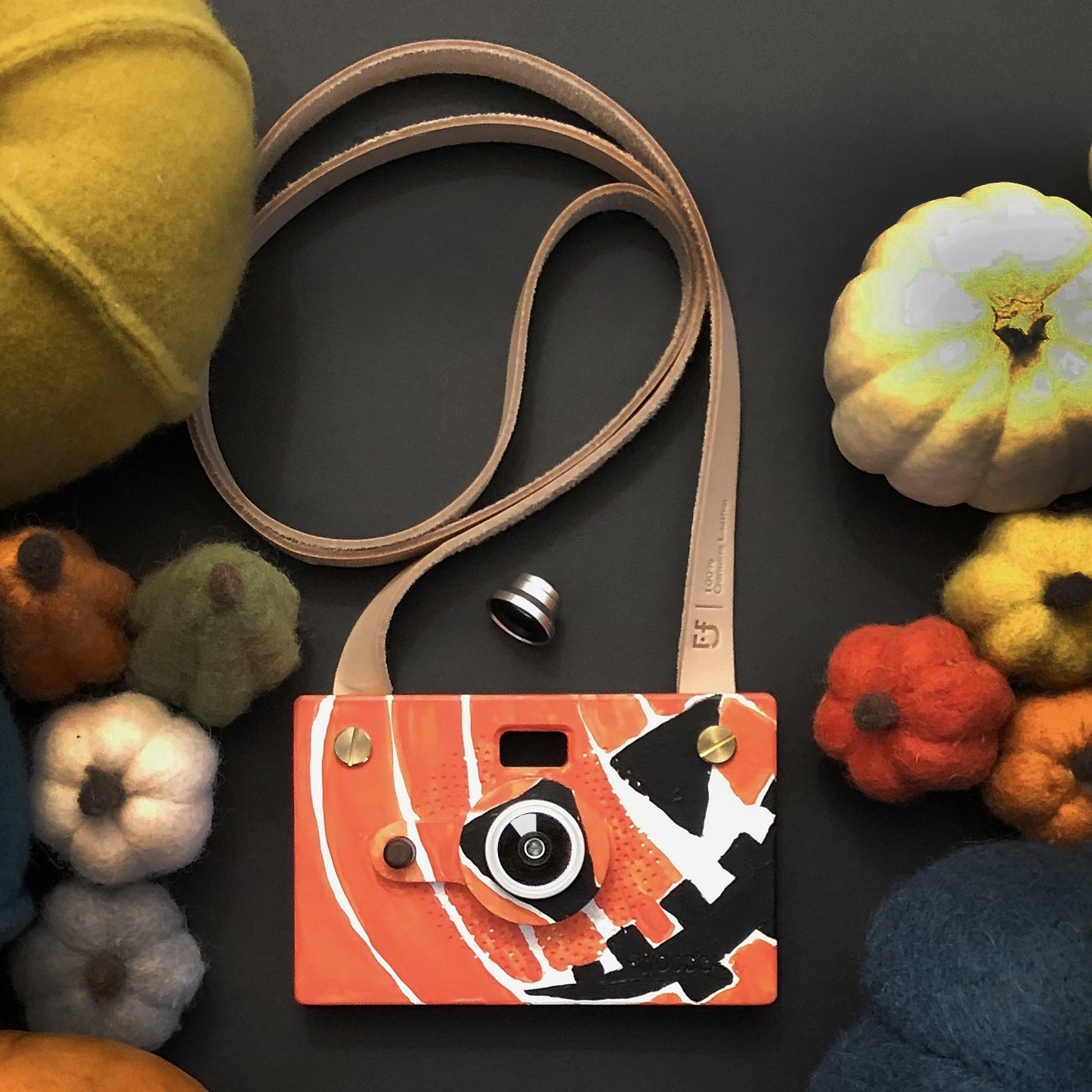 Father's Factory Woodcam is a working digital camera with handcrafted wooden case. Features 8 megapixel resolution. This vegan leather strap is a good addition for Father's Factory wooden digital cameras to prevent it dropping on the floor.