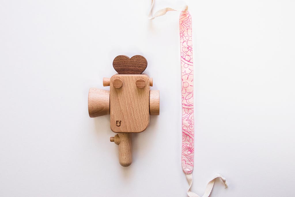 Handheld strap for Father's Factory Super 8 wooden toy camera. The strap is handmade in los angeles with much love. it allows your little videographer to bring their favorite toys with them everywhere! The Sweet Dream pattern is limited quantities and limited edition for Valentine's Day