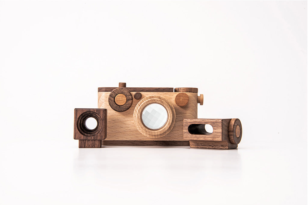 Father's Factory 35MM wooden toy camera made of walnut and beechwood with detachable flash, kaleidoscope lens, and button.