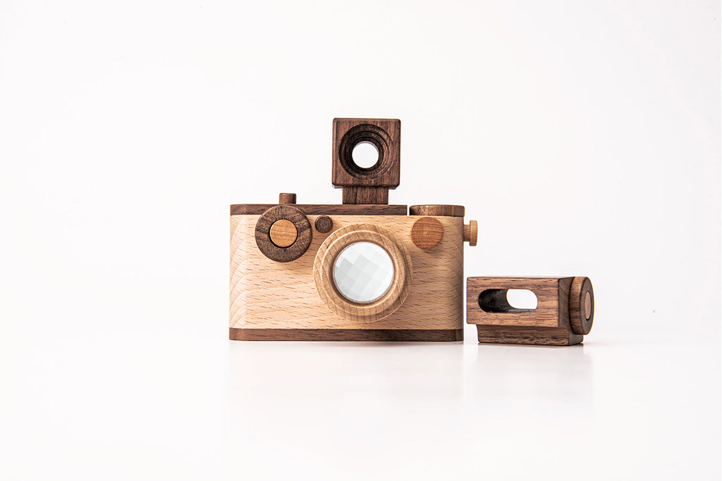 Father's Factory 35MM wooden toy camera made of walnut and beechwood with detachable flash, kaleidoscope lens, and button.