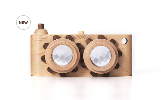 Twinkle wooden toy camera inspired by the stereo camera offers double the fun with two kaleidoscope lenses. Like a wooden binocular toy, Father’s Factory twinkle wooden toy camera has 2 lenses. Children can look through the lenses and find wonders. The kaleidoscopic lens will enhance creativity in children and offers high-quality playtime. Father's factory wooden toys can double as interior decor, kid’s room decor, and playroom display.