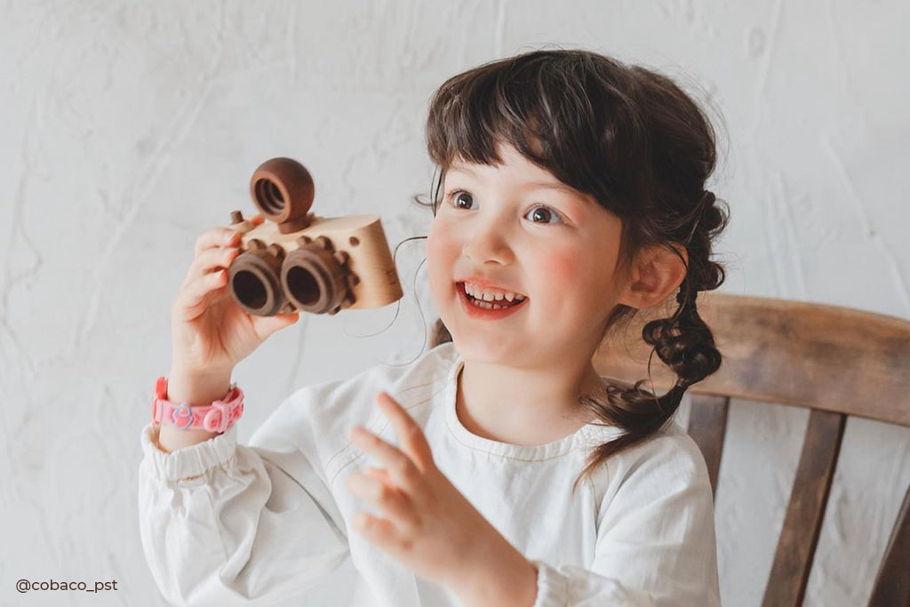 Twinkle wooden toy camera inspired by the stereo camera offers double the fun with two kaleidoscope lenses. Like a wooden binocular toy, Father’s Factory twinkle wooden toy camera has 2 lenses. Children can look through the lenses and find wonders. The kaleidoscopic lens will enhance creativity in children and offers high-quality playtime. Father's factory wooden toys can double as interior decor, kid’s room decor, and playroom display.