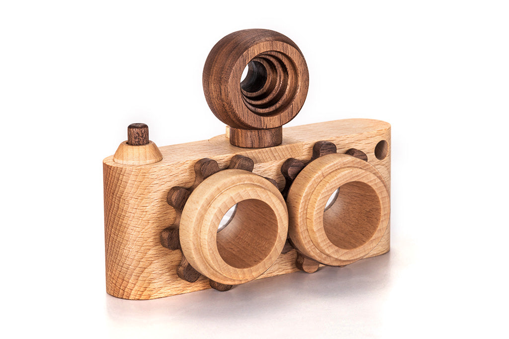 Twinkle wooden toy camera inspired by the stereo camera offers double the fun with two kaleidoscope lenses. Like a wooden binocular toy, Father’s Factory twinkle wooden toy camera has 2 lenses. Children can look through the lenses and find wonders. The kaleidoscopic lens will enhance creativity in children and offers high-quality playtime. Father's factory wooden toys can double as interior decor, kid’s room decor, and playroom display.