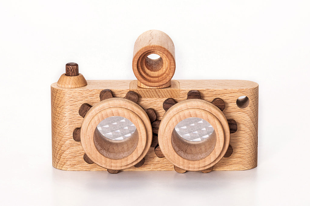 Twinkle wooden toy camera inspired by the stereo camera offers double the fun with two kaleidoscope lenses. Like a wooden binocular toy, Father’s Factory twinkle wooden toy camera has 2 lenses. Children can look through the lenses and find wonders. The kaleidoscopic lens will enhance creativity in children and offers high-quality playtime. Father's factory wooden toys can double as interior decor, kid’s room decor, and playroom display.