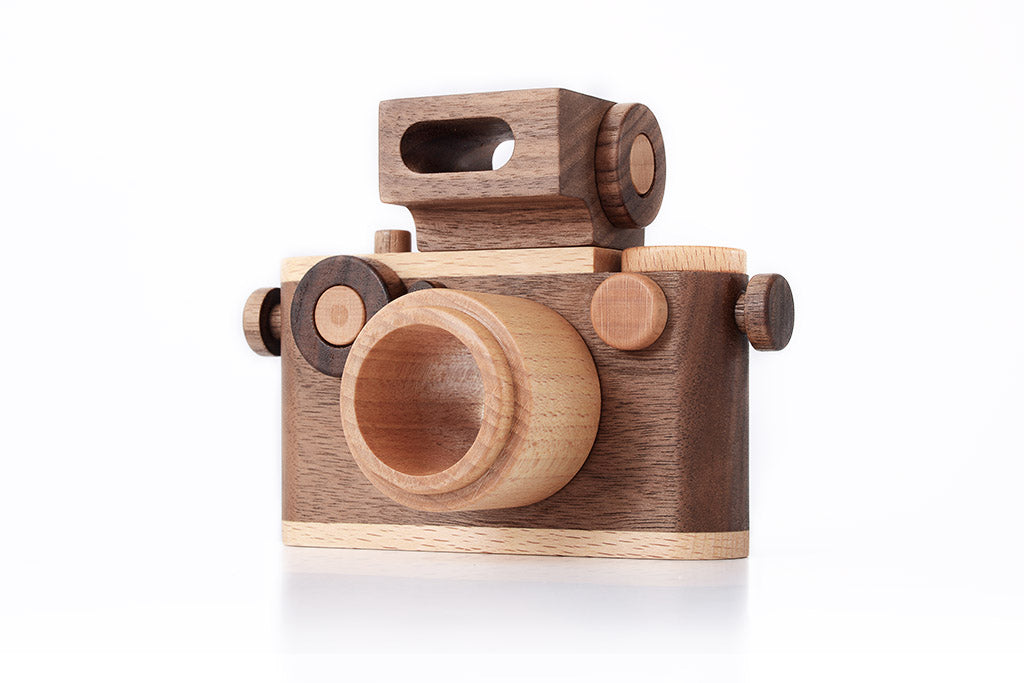 Toy camera crafted from walnut and maple wood with vintage design, detachable flash, clickable button, and kaleidoscopic lens