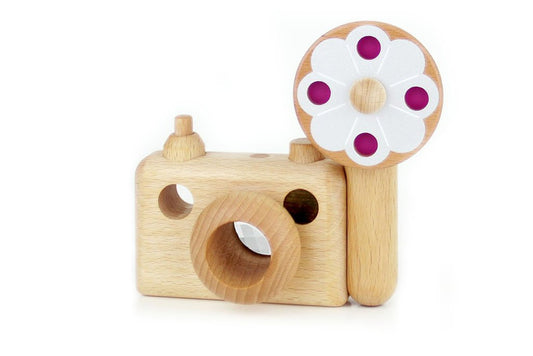 Photo shows a wooden toy camera inspired by the vintage 35MM camera on display. The toy camera comes with a vintage flash, and it’s the best first camera for encouraging children’s creativity. Wooden toys are safer than plastic toys because they are made of non-toxic and biodegradable materials. When choosing wooden toys, wooden toy camera is the essential type of toy for your child’s open-ended playtime. Choose from Father’s Factory wooden toy camera today as they are the toys double as interior decor.