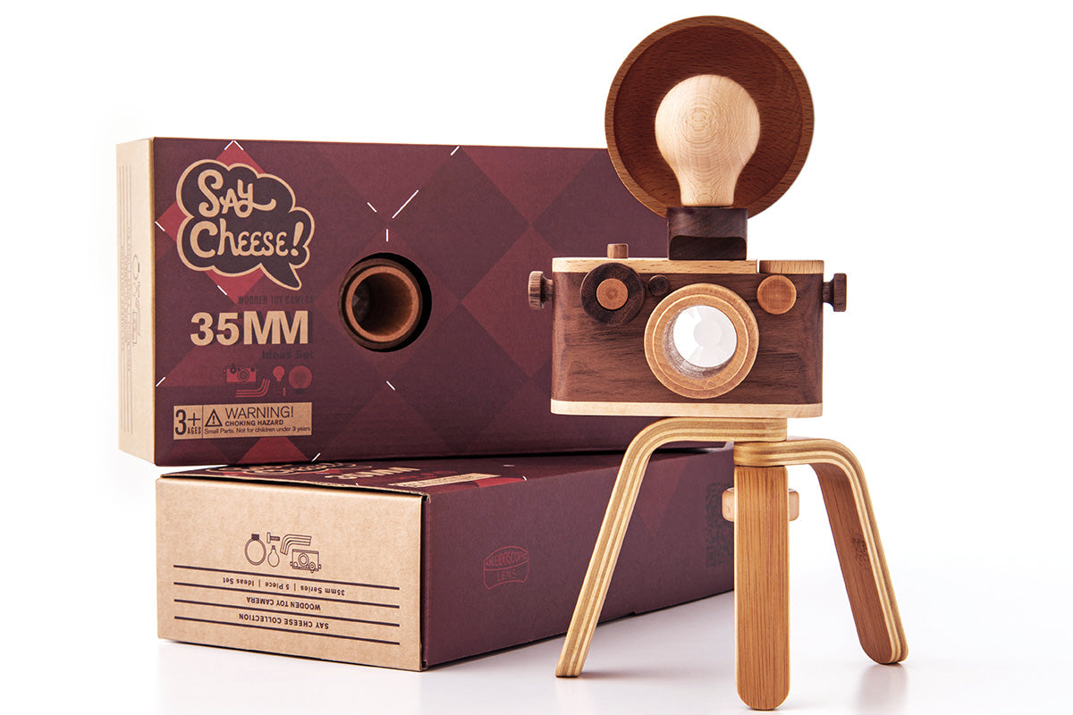 Delight your little photographers with father’s factory high-quality wooden toy camera that's sure to become a treasured keepsake. Crafted of durable, beautifully beech wood and walnut, this toy encourages all-day imaginative story-telling for your child and family. This toy camera also doubles as interior decor. each wooden toy comes with a kaleidoscopic viewfinder, a clickable button, and a movable rewind handle.