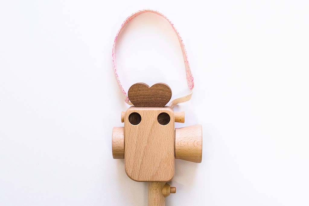 Handheld strap for Father's Factory Super 8 wooden toy camera. The strap is handmade in los angeles with much love. it allows your little videographer to bring their favorite toys with them everywhere! The Sweet Dream pattern is limited quantities and limited edition for Valentine's Day