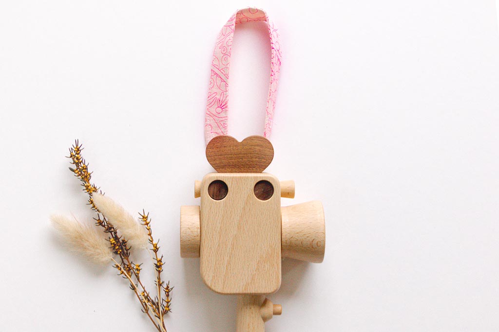 Handheld strap for Father's Factory Super 8 wooden toy camera. The strap is handmade in los angeles with much love. it allows your little videographer to bring their favorite toys with them everywhere! The Sweet Dream pattern is limited quantities and limited edition for Valentine's Day