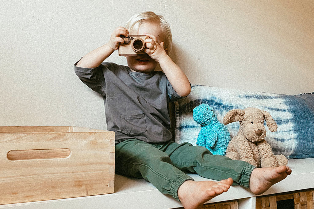 Father's Factory wooden toy camera, 35MM Original wooden toy camera with detachable magnetic flash, clickable button and kaleidoscopic lens. It’s perfect toy camera for pretend play, sensory play, and homeschooling. This camera for kids is made of walnut and beechwood with heirloom quality. Non-toxic wooden toys, child-led play wood toys, wooden toys for children, and environmental friendly toy. Tested To Meet All Safety Standards. The wooden toy camera can be an interior decor item for kid’s room.