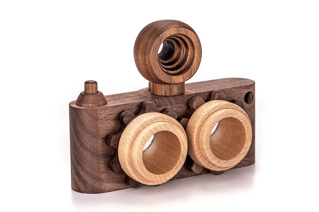 Twinkle wooden toy camera inspired by the stereo camera offers double the fun with two kaleidoscope lenses. Like a wooden binocular toy, Father’s Factory twinkle wooden toy camera has 2 lenses. Children can look through the lenses and find wonders. The kaleidoscopic lens will enhance creativity in children and offers high-quality playtime. Father's factory wooden toys can double as interior decor, kid’s room decor, and playroom display.